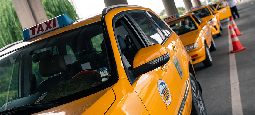 Authorized taxis awaiting passengers.