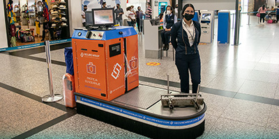'Secure Wrap' island for baggage wrapping.